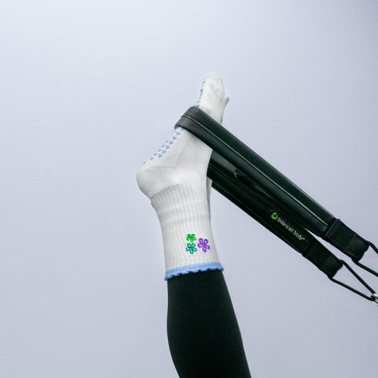 White sock with a colorful design on a gray background